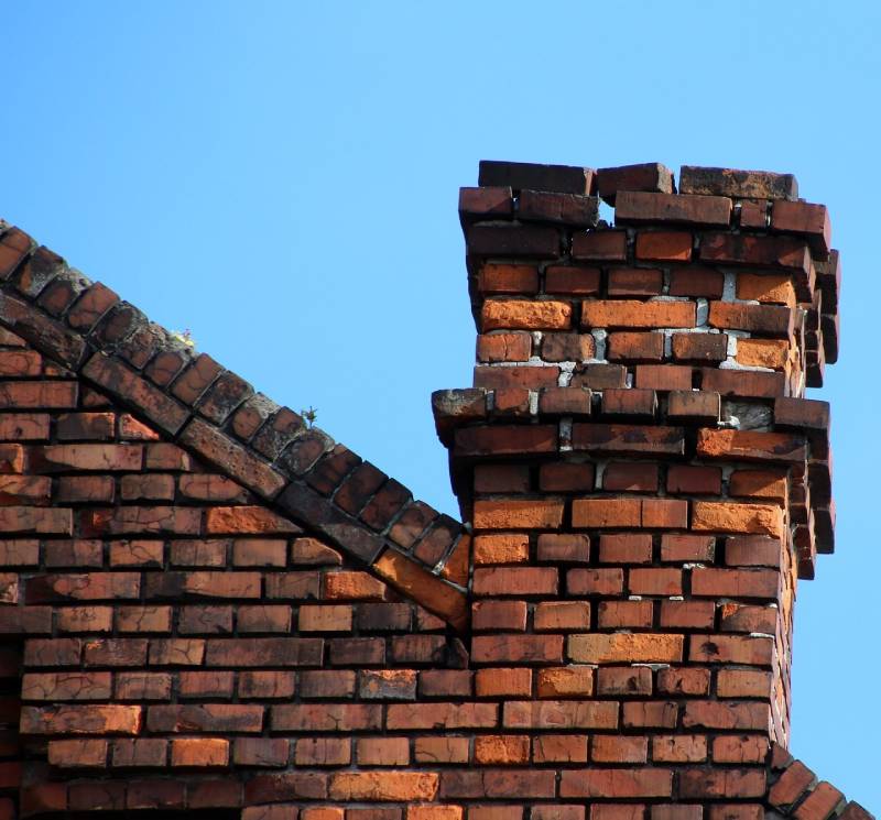Damaged chimney on an Ijamsville home showing cracks and missing mortar